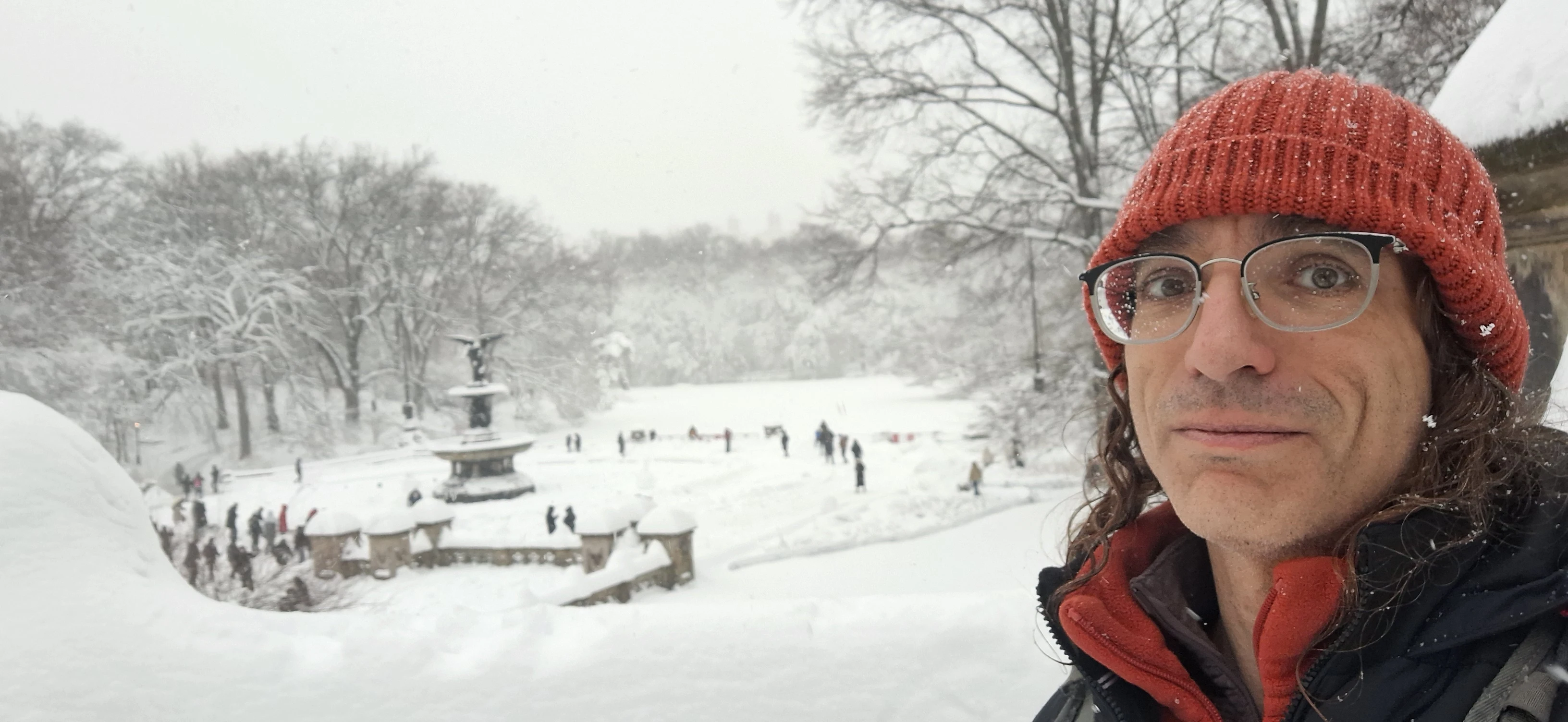 Rick Massel in a red beanie during a snowstorm at Bethesda Fountain in New York City.